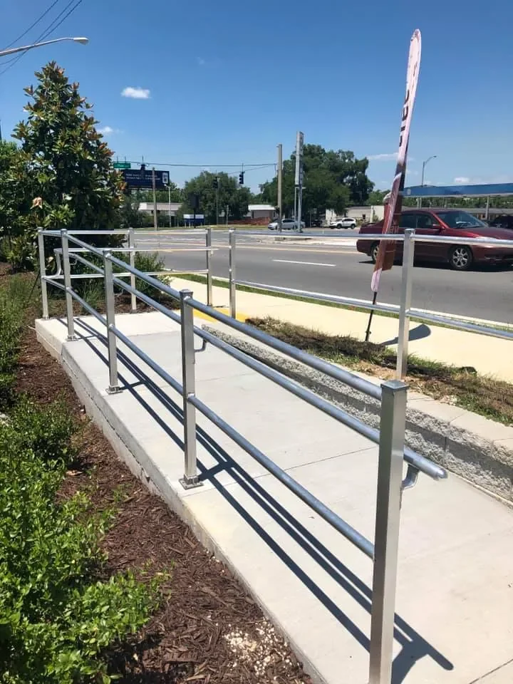 Standard aluminum railing installed along commercial access ramp in Florida