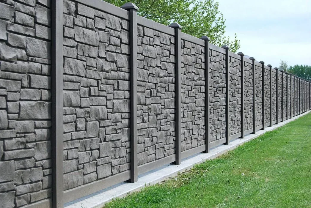 Gray stone texture vinyl privacy fence with decorative post caps installed along a residential property in Florida